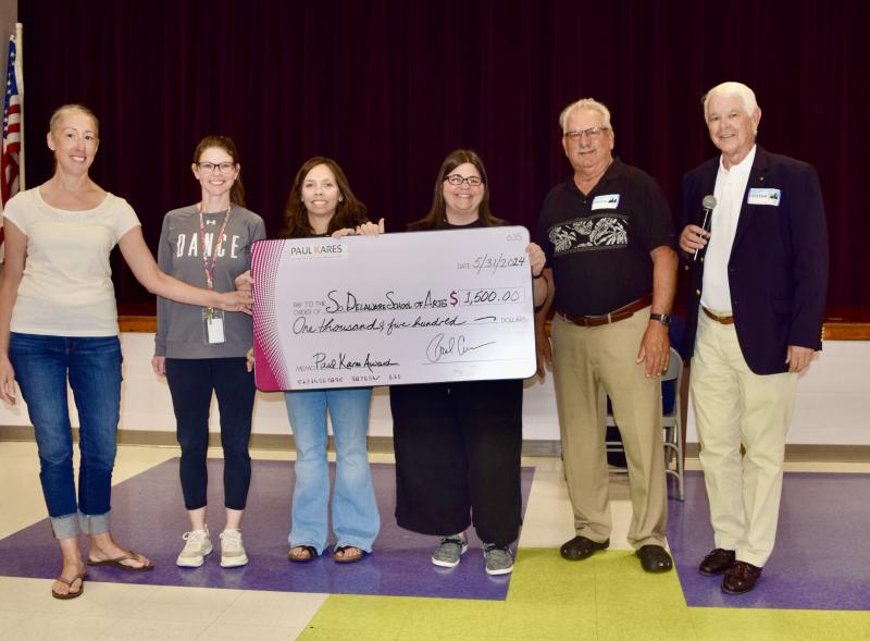 Southern Delaware School of the Arts check presentation attendees shown are (l-r) Amy Bandy, visual arts teacher; Allison Bower, dance teacher; Melody Oneschuk, instrumental music teacher; Mary Caligiure, vocal music teacher; Fran Simeone, Paul Kares director of development; and Jim Rivette, Paul Kares co-founder. SUBMITTED PHOTO